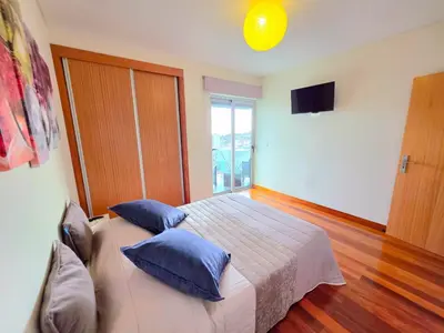 a bathroom with a toilet and a sink and a shower at Spacious Summer Fresh Family Apartment with Panoramic Sea Views in Funchal in Funchal