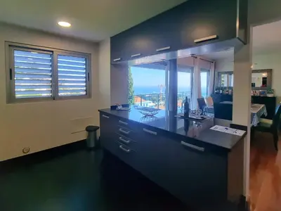 two cars parked in an underground parking garage at Spacious Summer Fresh Family Apartment with Panoramic Sea Views in Funchal in Funchal