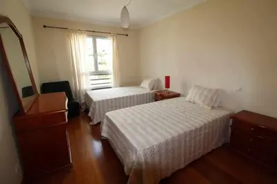 a hotel room with two beds and a window at Comfy and Charming Palace in Funchal