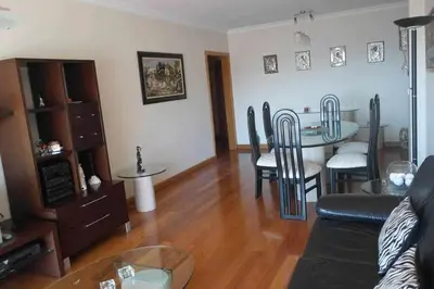 a living room with a table and chairs and a couch at Comfy and Charming Palace in Funchal