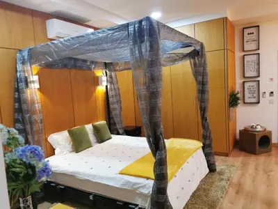 a bed with a canopy in a room at Madeira Loft I - City Center in Funchal