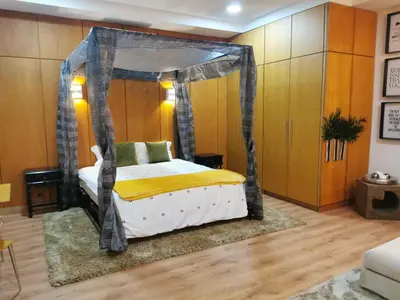 a bedroom with a bed with a canopy at Madeira Loft I - City Center in Funchal