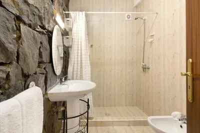 a bathroom with a sink and a shower at Casa Cristina in Santo da Serra