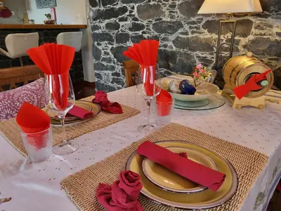 a table with red napkins and wine glasses on it at Boutique Chalet in Calheta in Arco da Calheta