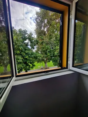 a window with a view of a tree at Funchal Old Town Studios - Historic Atlantic View in Funchal