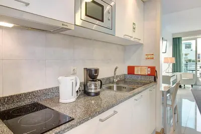 a kitchen with a sink and a counter top at Dfm Happy Days F - Funchal in Funchal