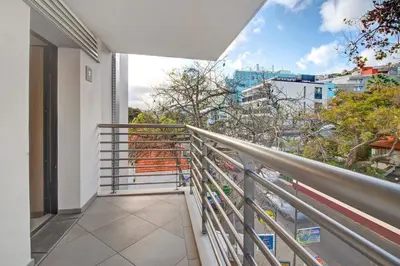 a balcony with a view of a city at Dfm Happy Days F - Funchal in Funchal