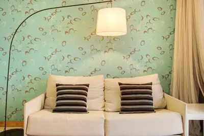 a white couch in a room with a green wall at Dfm Happy Days B - Funchal in Funchal