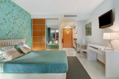 a bedroom with a bed and a living room at Dfm Happy Days D - Funchal in Funchal