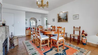 a dining room with a table and chairs at CoolHouses Algarve Luz, 3 Bed Townhouse, central & superb view, Casa Salute (100066/AL) in Luz