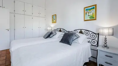 a bedroom with two white beds and a lamp at CoolHouses Algarve Luz, 3 Bed Townhouse, central & superb view, Casa Salute (100066/AL) in Luz