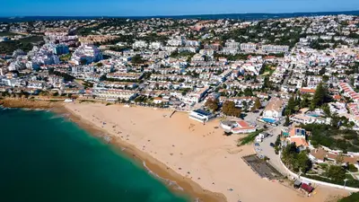 an aerial view of a beach and buildings at CoolHouses Algarve Luz, 3 Bed Townhouse, central & superb view, Casa Salute (100066/AL) in Luz