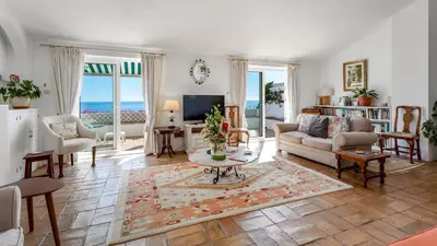 a living room with a couch and a table at CoolHouses Algarve Luz, 3 Bed Townhouse, central & superb view, Casa Salute (100066/AL) in Luz