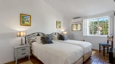 a bedroom with a white bed and a window at CoolHouses Algarve Luz, 3 Bed Townhouse, central & superb view, Casa Salute (100066/AL) in Luz