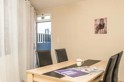 a dining room with a table and chairs at Sunset House in Ribeira Brava
