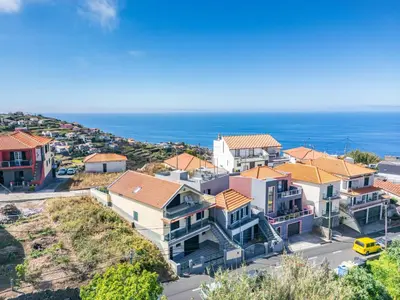 an aerial view of a house with the ocean in the background at Sunset House in Ribeira Brava