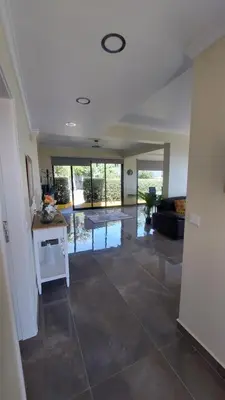 a large living room with a large tile floor at Villa Strelitzia in Funchal