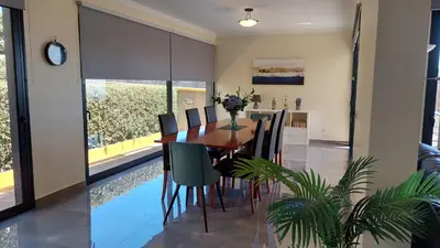 a dining room with a table and chairs at Villa Strelitzia in Funchal