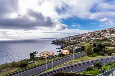 a road next to a body of water at Guesthouse Olival in Santa Cruz