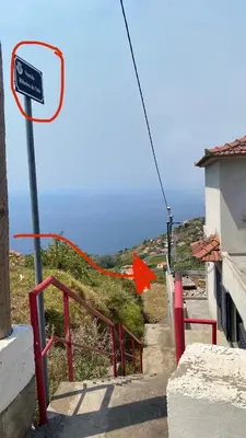 an orange ribbon is attached to a basketball hoop at Cozy 1 BR w/ balcony, ocean view & perfect sunsets in Ribeira Brava