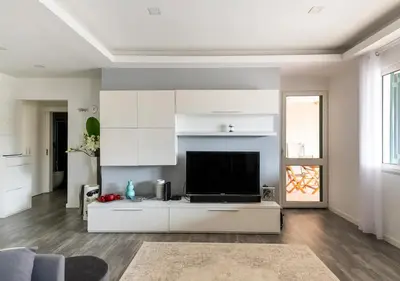 a living room with a flat screen tv in the middle at Lovely 1-bedroom apartment with parking ocean view in Funchal