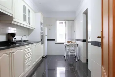 a dining room with a table and a mirror at Elsas Place in Funchal