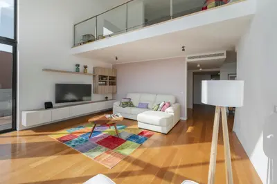 a living room with a couch and a table at Villa das Quebradas by An Island Apart in Funchal