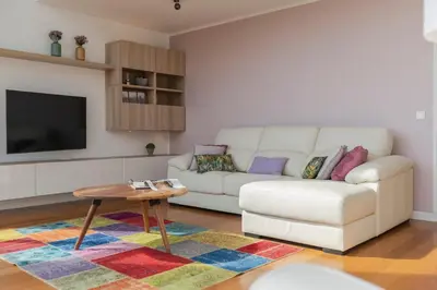 a living room with a white couch and a table at Villa das Quebradas by An Island Apart in Funchal