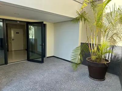 a plant in a large pot next to a building at Ines Seaview Apartment in Funchal