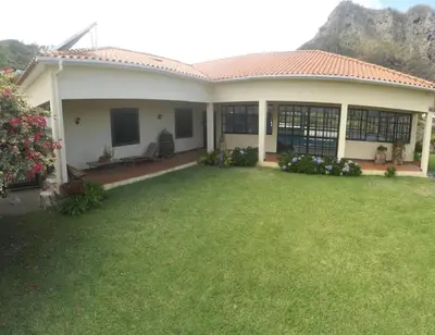 a house with a lawn in front of it at House pc in Porto da Cruz