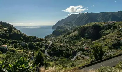 a view of a mountain valley with a road at House pc in Porto da Cruz