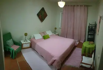 two beds in a room with towels on them at House pc in Porto da Cruz
