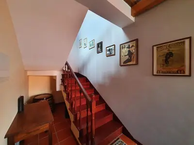 a staircase in a house with posters on the wall at Mountain-Ocean-View Madeira in São Vicente