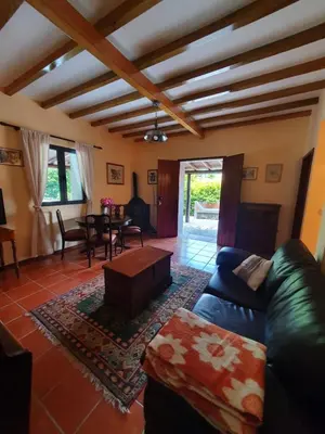 a living room with a couch and a table at Mountain-Ocean-View Madeira in São Vicente