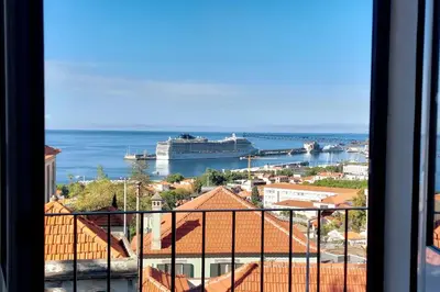 a view of the ocean and a cruise ship at Villa Carvalhal in Funchal