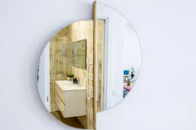 a bathroom with a sink and a mirror at The Kuuyi Suite in Burgau