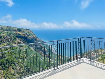 a balcony with a view of the ocean at Villa Camacho xxvii in Arco da Calheta