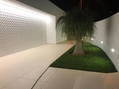 a room with a palm tree in the middle of it at Villa Camacho - Ultra Luxury in Calheta