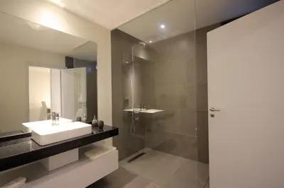 a bathroom with a sink and a shower at Villa Camacho iv - Mansion House in Arco da Calheta