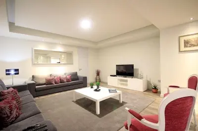 a living room with a couch and a tv at Villa Camacho iv - Mansion House in Arco da Calheta
