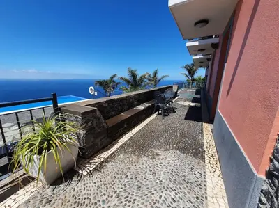 a balcony of a building with a view of the ocean at Ocean View Madeira 3 - Ponta do Sol in Canhas