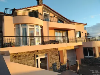 a house with a balcony on top of it at Beautiful View 2 - Arco da Calheta - Ilha da Madeira in Arco da Calheta