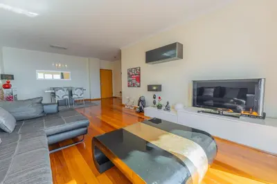 a living room with a couch and a table at FLH Garajau Fantastic Ocean View with Balcony in Funchal