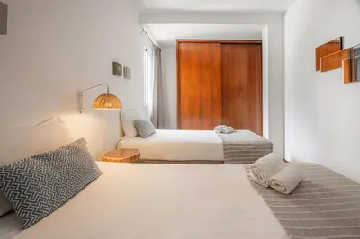 a hotel room with a bed and a window at Portola Penthouse by YMR in Funchal