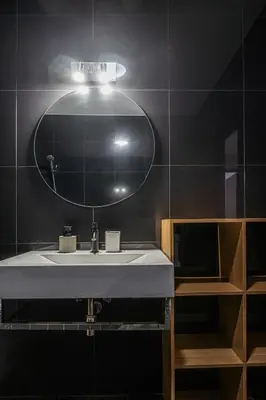 a bathroom with a sink and a mirror at Portola Penthouse by YMR in Funchal