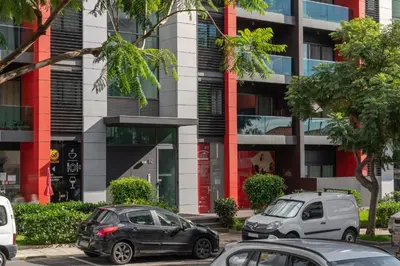 two cars parked in front of a building at Madalenas XXI by An Island Apart in Funchal