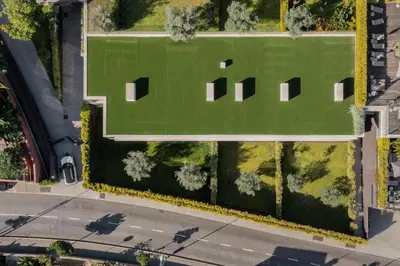 an overhead view of a green field with a road at Savoy Residence Casa Branca I by An Island Apart in Funchal