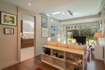 a living room with a couch and a television at Savoy Residence Casa Branca I by An Island Apart in Funchal