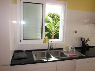 a kitchen with a sink and a window at Villa Hansen in Garajau - Cristo Rei in Caniço