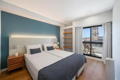 a bedroom with a large bed and a large window at Atlantic Blue 1 - central and with garage in Funchal